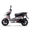 A white scooter with red accents parked on top of the road.