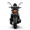 A motorcycle with the lights on and rear view mirror.