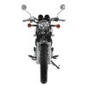 A motorcycle with the front lights on and handlebars down.