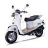 A white scooter is parked on the ground.