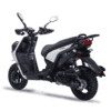A black and white scooter is parked on the ground.