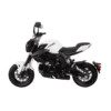 A white and black motorcycle is parked on the ground