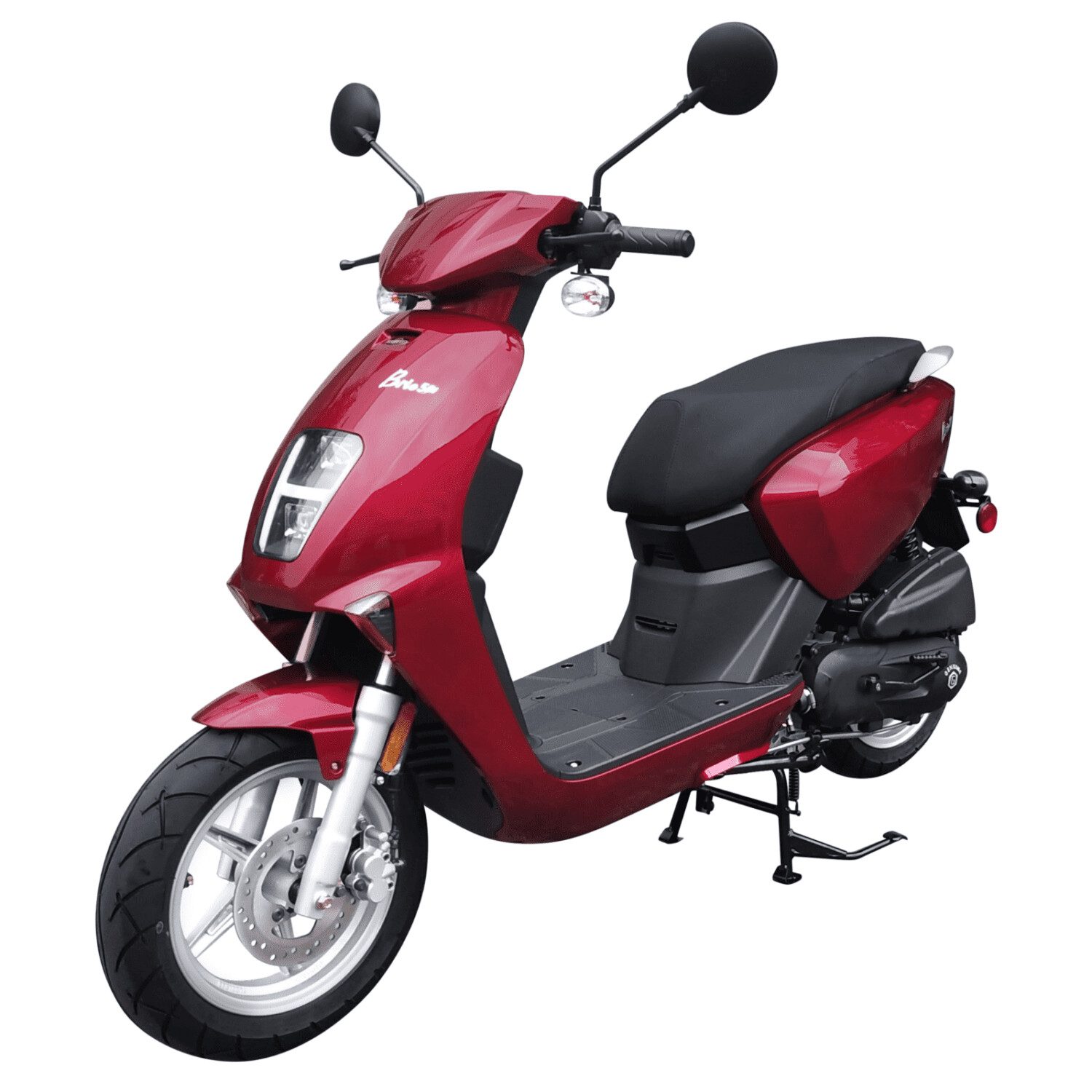 A red scooter is parked on the street.