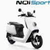A white scooter is parked on the ground.