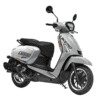 A white scooter is parked on the street.