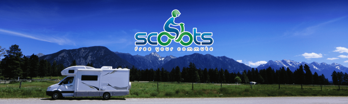 A picture of the mountains and trees in front of scoots. A picture of the mountains and trees in front of scoots.