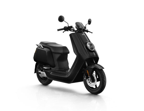 A black scooter is parked on the ground.