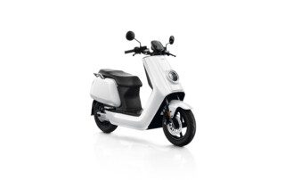 A white scooter is parked on the ground.