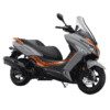 A silver and orange scooter parked on top of the ground.