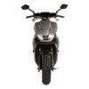 A front view of the motorcycle with its lights on.