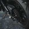 A close up of the front wheel on a motorcycle.