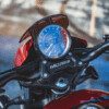 A close up of the speedometer on a motorcycle.